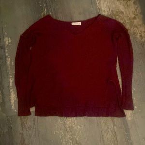 A light sweater. Burgundy.